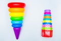 Children's educational toys: a pyramid and sorters lie on a white background with a place for text. top view, flat lay Royalty Free Stock Photo