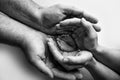 Children& x27;s foot in the hands of mother, father, parents. Feet of a tiny newborn close up. Little baby legs. Royalty Free Stock Photo