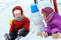 Children& x27;s game in snow outside, winter holidays, games and have fun. Little Children Kids Boy and girl, brother sister Royalty Free Stock Photo