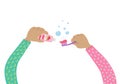 Children's hands in pajamas are holding a toothbrush and toothpaste. The child brushes his teeth and takes care of his