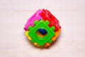 Children& x27;s multicolor plastic constructor on wood. Royalty Free Stock Photo