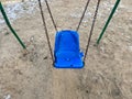 Children's plastic broken swings on the playground Royalty Free Stock Photo
