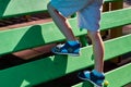 children& x27;s playground in a public park, kid& x27;s entertainment and recreation, mountaineering training, with kid& x27;s leg Royalty Free Stock Photo