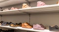 Children's shoe store. Shelf in the store with baby winter boots. Royalty Free Stock Photo