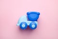 Children's toy car on pink background. Logic, the development of intelligence. Royalty Free Stock Photo