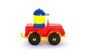 Children's toy, red plastic car with driver on white background. Royalty Free Stock Photo