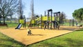 Children yellow playground activities in public green park modern