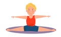 Childrenes sports gymnastics. Stretching exercise, cross splits. The boy is engaged in acrobatics