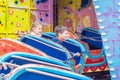 Childrens in amusement park. Royalty Free Stock Photo