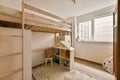 a childrens bedroom with bunk beds and a rug Royalty Free Stock Photo