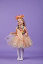 Childrens birthday party, masquerade. Little happy toddler child girl in a puffy tutu fancy dress,