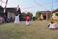 Childrens competiting in sack race. Celebration to welcome Independence day of Indonesia