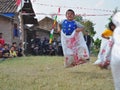 Childrens competiting in sack race. Celebration to welcome Independence day of Indonesia