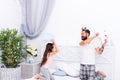 Childrens day. funny leisure time. relax together at home. daughter with father fight with pillows. happy family of teen Royalty Free Stock Photo