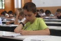 Childrens in an exam. Royalty Free Stock Photo