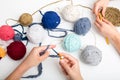 Childrens hands are crocheted and thread. View from above Royalty Free Stock Photo