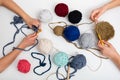 Childrens hands are crocheted and thread. View from above Royalty Free Stock Photo