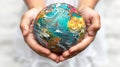 Childrens hands hold the globe. White background. Free space for text. Royalty Free Stock Photo