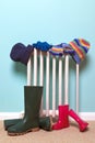 Childrens hats, gloves and wellies by radiator