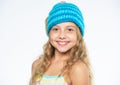 Childrens knitted hats. Girl long hair happy face white background. Kid wear warm soft knitted blue hat. Difference