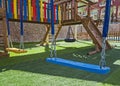 Childrens outdoor play area with swings Royalty Free Stock Photo