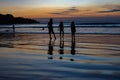 Childrens play on sunset Indian ocean Royalty Free Stock Photo