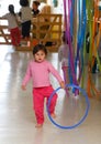 Childrens playing with their teacher at Kindergarten in classroom vertical