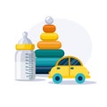 Childrens pyramid, yellow car and baby bottle