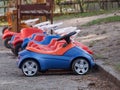 Childrens ride on plastic cars Royalty Free Stock Photo