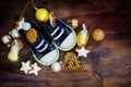 Childrens shoes filled with cookies and christmas decoration for