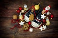 Childrens shoes filled with sweets and red christmas decoration