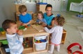Childrens and their teacher at Kindergarten in classroom Royalty Free Stock Photo