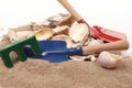 Childrens toy garden tools and on the beach Royalty Free Stock Photo
