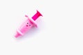 Childrens toy syringe pink isolated object on white background Royalty Free Stock Photo
