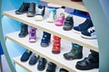 Childrens winter and autumn shoes in store Royalty Free Stock Photo