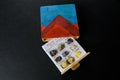 Childrens work - a box with different minerals and sulfur pieces