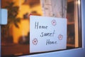 Childs Drawing Phrase Home, sweet home on white card. Handmade Board with Cute Cozy Text. Vintage Lettering House Design Royalty Free Stock Photo