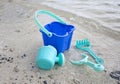 A childs green beach bucket and spades Royalty Free Stock Photo