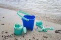 Childs green beach bucket and spades Royalty Free Stock Photo