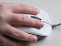 A childs hand om a computor mouse Royalty Free Stock Photo