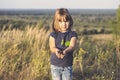 Little girls hands holding a small maple tree Royalty Free Stock Photo