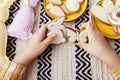 Childs hands showcase Easter cookies, joy of Easter traditions concept