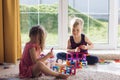 The childs is playing with a multi-colored magnetic constructor, building a tower. Educational toys . A building block for a baby Royalty Free Stock Photo