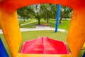 Childs pov looking down a slide in a playground