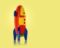 Childs toy rocket on yellow background Royalty Free Stock Photo