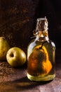 Chilean brandy with whole pear inside bottle. Aguardiente de pera. Royalty Free Stock Photo