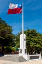 Chilean flag whipping in the wind at a memorial, Punta Arenas, M