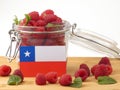 Chilean flag on a wooden panel with raspberries isolated on a wh Royalty Free Stock Photo
