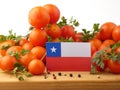 Chilean flag on a wooden panel with tomatoes isolated on a white Royalty Free Stock Photo