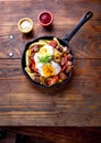 CHILEAN FOOD. CHORRILLANA - french fries topped with beef sliced, tipical sausages chorrisos, fried onion and eggs
